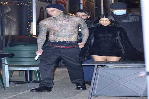 Kourtney Kardashian stuns in black dress & holds shirtless Travis Barker’s hand as they’re..