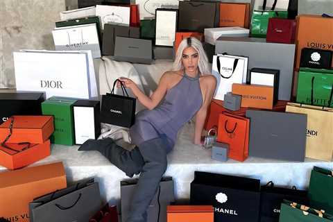 Kardashian fans slam Kim as ‘tasteless’ for posing with a mountain of designer bags after outrage..