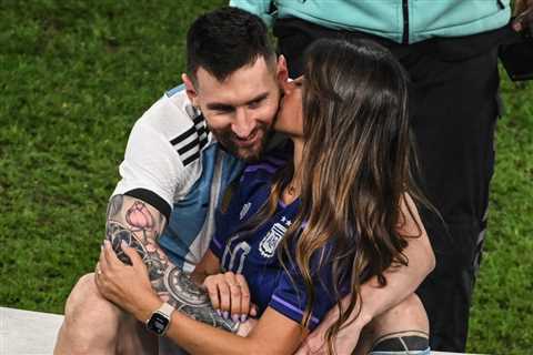 Lionel Messi’s wife, Antonela Roccuzzo, kisses him after Argentina’s World Cup win