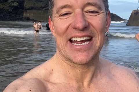 Topless Ben Shephard strips down to his trunks for freezing cold swim in the sea on Christmas..