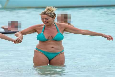 Claire Sweeney, 51, shows off her incredible curves in blue bikini as she goes for a dip in the sea