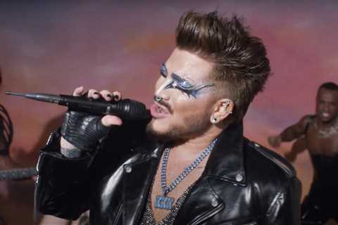 Adam Lambert Saves Himself (& Everyone Else) in Glamorous ‘Holding Out For A Hero’ Video: Watch