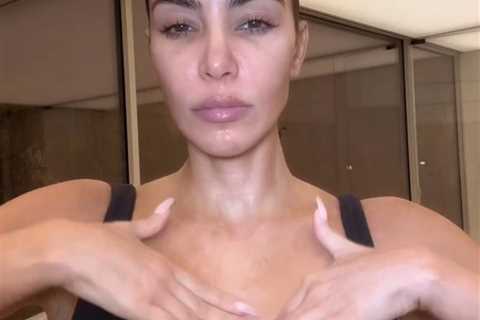 Kim Kardashian flaunts her tiny waist as she ditches her top in new video taken inside huge..