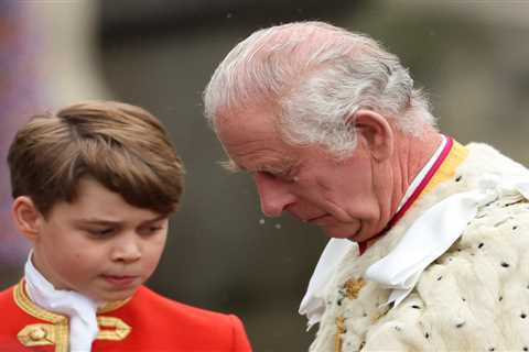 Prince George, 9, looks solemn as he holds his grandfather King Charles’ robe in special role at..