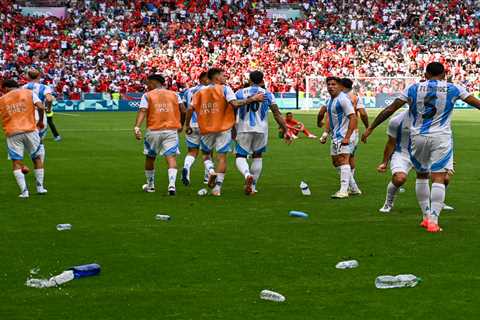 Fans storm field, throw objects at Argentina soccer players after stunning Olympics equalizer that..