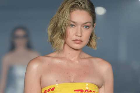 Gigi Hadid’s DHL Tape Strapless Minidress Turns Heads on PFW Runway