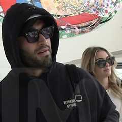 Sam Asghari Filmed With Britney Look-Alike Girlfriend at LAX Airport