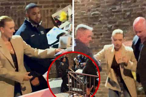 Scarlett Johansson Signs Autographs as Fan Barricade Collapses, on Video