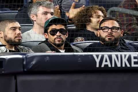 Bad Bunny seems to sit during ‘God Bless America’ at Yankee Stadium as Super Bowl controversy grows