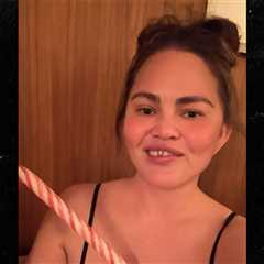 Chrissy Teigen Knocks Out Front Tooth With Candy Cane, in Hilarious Video