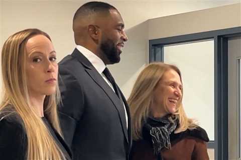 Disgraced Michigan coach Sherrone Moore yuks it up in court as wife Kelli stares daggers after..