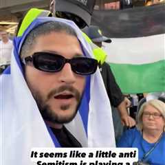 Moment Israeli flag-waving fan ejected from World Cup game — as Palestinian flag allowed to stay