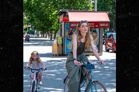 Amber Heard Makes Rare Outing With Daughter in Madrid
