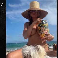 Heidi Klum Goes Topless For Beach Day, Tanning and Eating Chips