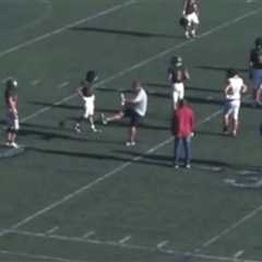 Moment raging high school football coach blasts ball into youngster’s crotch